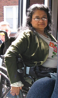 woman boarding the bus in a wheelchair